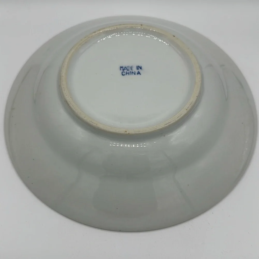 Chinese blue, white, and teal serving bowl with birds and lily pads